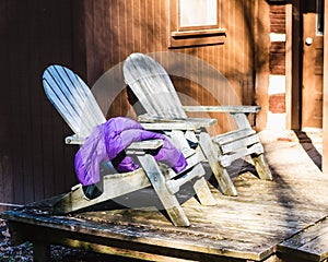 Two Aqua Adirondack Chairs on a Cabin Porch