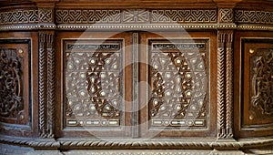 Two arabesque sashes of an old mamluk era cupboard with geometrical decorations photo