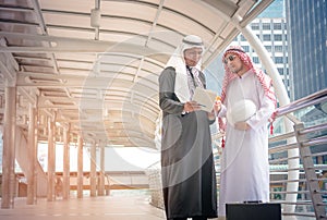 Two Arabian business people discussing together
