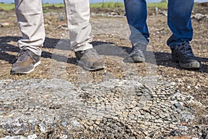 Two archeologists standing beside a mosaic. Archeological excavation concept