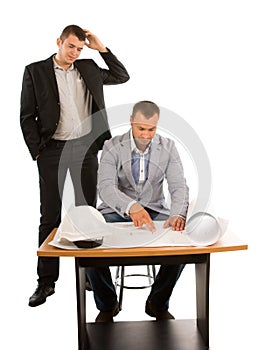 Two architects or builders working on a plan