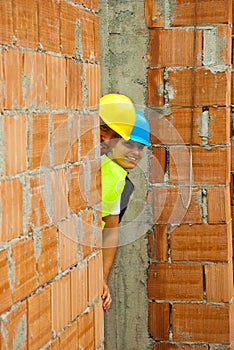 Two architects hidden behind wall