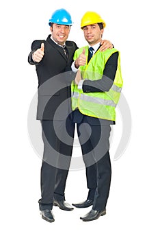 Two architects men giving thumbs