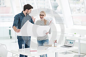 Two architects working together in office