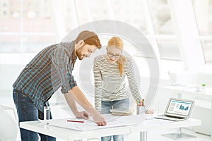 Two architects working together in office