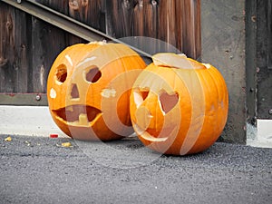 Two artistically carved pumpkin lantern for Halloween