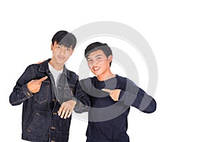 Two Asian boys are pointing to themselves.