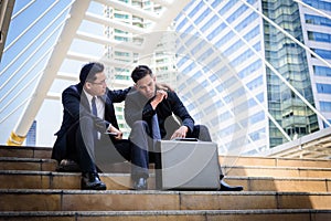 Two asian Businessman feel sad and frustrated upset fail in life