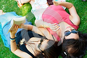 Two asian girl lying on a grass