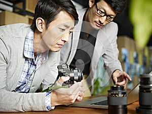 Two asian photographers at work