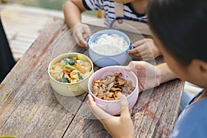 Two asian woman eating food in pinto