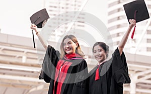 Two asian women happy with graduation