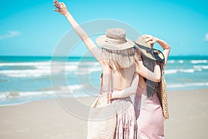 Two Asian women jogging on the beach in the morning. Rest time and holidays