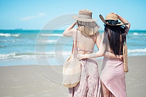 Two Asian women jogging on the beach in the morning. Rest time and holidays