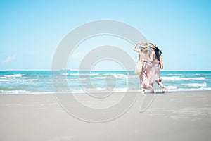 Two Asian women jogging on the beach in the morning. Rest time and holidays