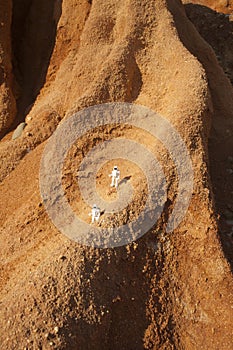 Two astronauts exploring valles marineris in mars, concept
