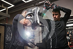 two athlete men training before fight, practice kickboxing, strength and motivation