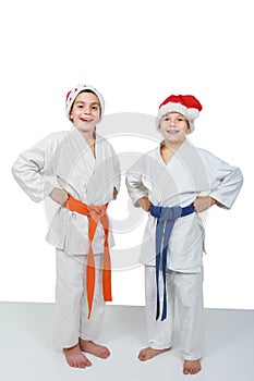 Two athletes in caps of Santa Claus