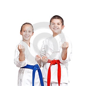 Two athletes in karategi are standing in the rack of karate photo