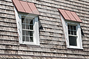 Two attic windows of house roof