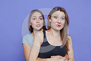 Two young women embrace very exciting of something photo