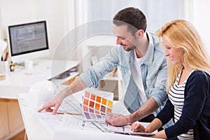 Two attractives architect working at the office photo