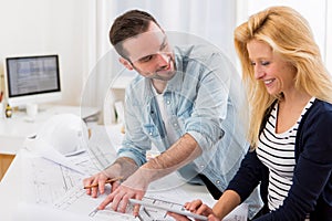 Two attractives architect working at the office photo
