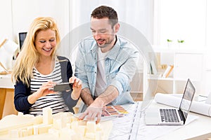 Two attractives architect working at the office photo