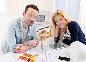 Two attractives architect working at the office photo