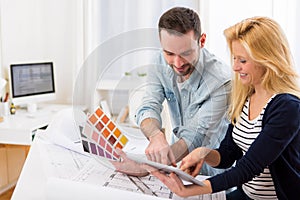 Two attractives architect working at the office photo