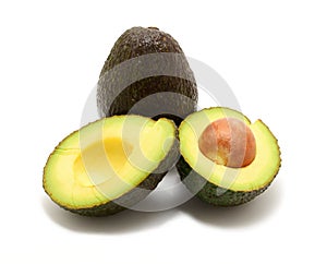 Two avocado over white background