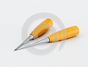 Two awls  for shoemakers with a wooden handle on a white background photo