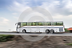 Two axle, rear engine, air-conditioned luxury bus , speeding on a highway in Pune, Maharashtra, India.