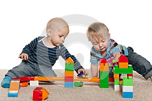 Two baby boys are playing