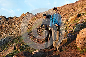Two backpackers in mountains