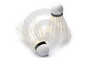 Two badminton shuttlecocks on white background