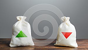 Two bags with green and red arrows up and down. Risk planning. Advantages and disadvantages. Useful and harmful. Decision making