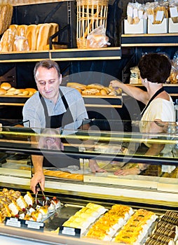 Two bakers at the counter at bakery