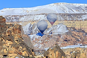 Two balloons on a background of mountains of Capadocia. Turkey.