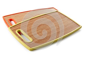 Two bamboo chopping boards in color plates, on a white background, isolate