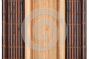 Two bamboo mat twisted in the form of manuscript on white background