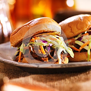 Two barbecue pulled pork slider sandwiches