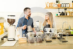 Two baristas working in a cafe