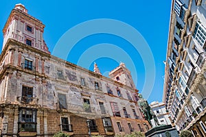 Perspective of the house of four towers and statue, architecture in the San Carlos neighborhood, CÃÂ¡diz SPAIN photo