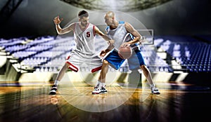 Two basketball players action in the gym