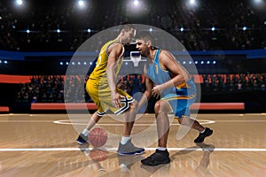 Two basketball players in scrimmage on basketball court