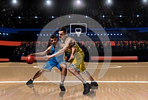 Two basketball players in scrimmage during basketball match