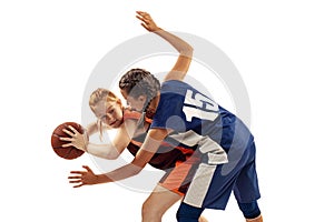 Two basketball players, young girls, teen playing basketball isolated on white background. Concept of sport, team