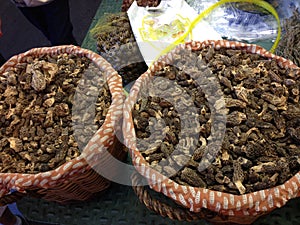 Two baskets of dried Morel mushrooms on the market stall in Barcelona, Spain