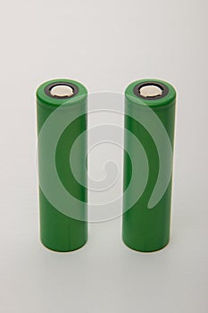 Two batteries for electronic cigarettes on a white background